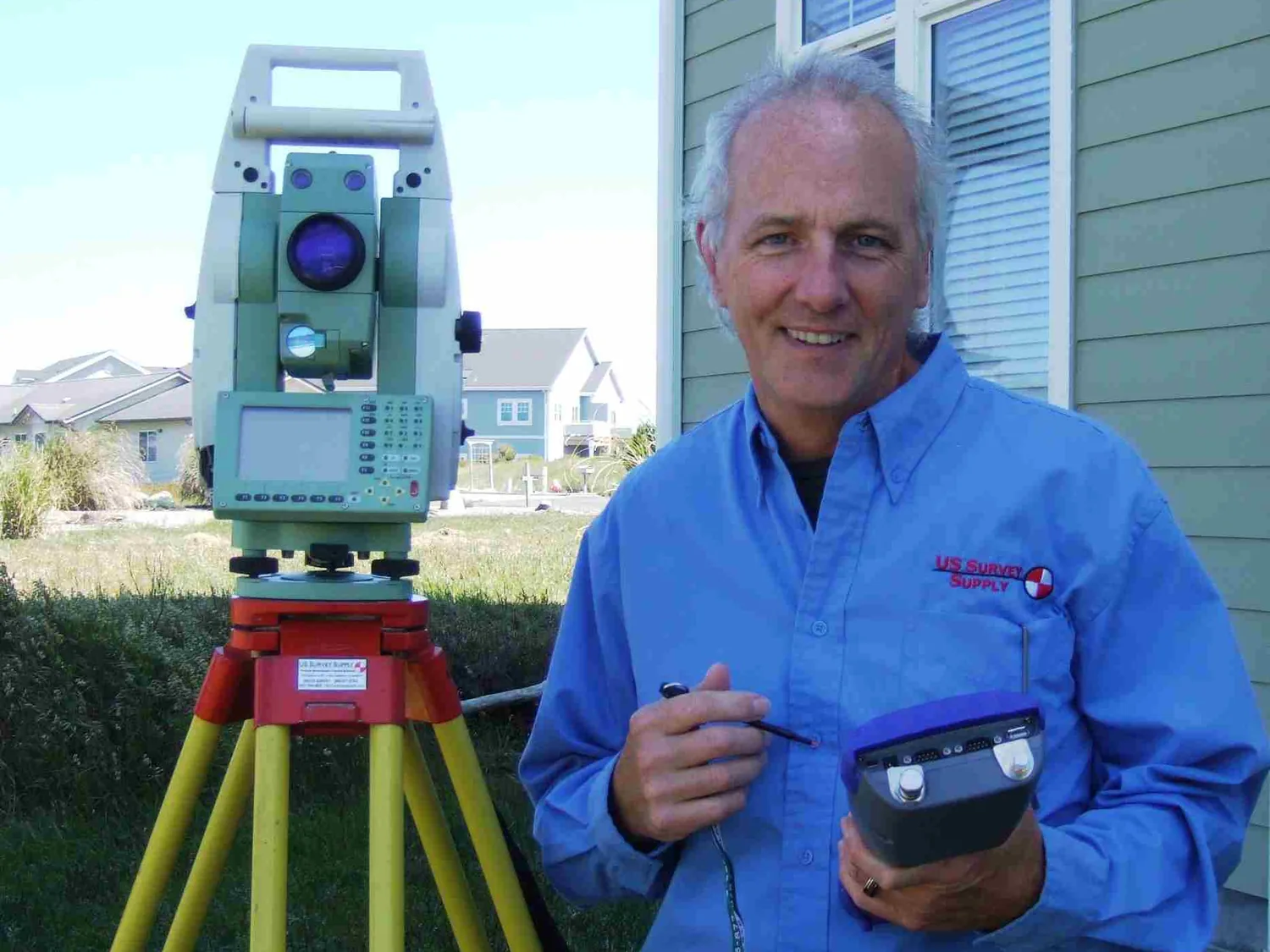 US Survey Supply owner in the field with a total station and data collector